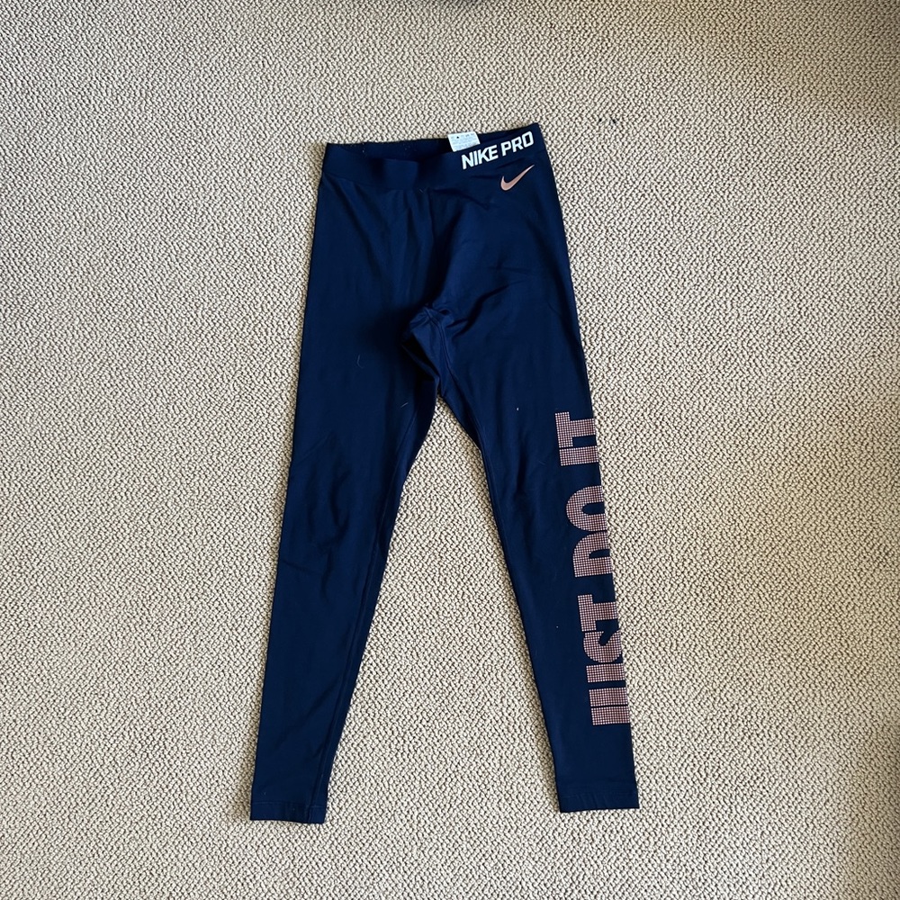Nike just do it leggings. Size small. Navy with copper writing.